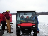 K&E Tackle Bum Lake ice fishing get together 02062011-076 kids eating in buggie