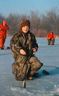 Young Angler With Panfish caught while ice fishing