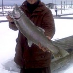 K&E Stopper Lures Pro Staff member Ray Tiffany of the HARD WATER MANIACS with a giant light line buck rainbow trout