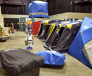 Ice fishing shanties and shelters are lined up, even floating in the air for the 2013 Ultimate Fishing Show Detroit ice extravaganza.