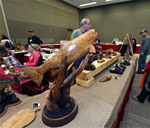 Taxidermy and wood carvings like this beautiful carved trout are just some of the family friendly attractions at the 2014 Ultimate Sport Show Grand Rapids