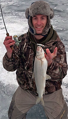 Winter is one of the best times to catch Crystal Lake whitefish – like this one caught by ice angler Andrew Joseph Brunner of Traverse City while jigging deep mud flats. Photo Credit: Andrew Joseph Brunner