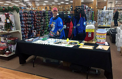 Joe Devera mans the table during Jay's Ice Day when he's not doing his ice fishing seminar