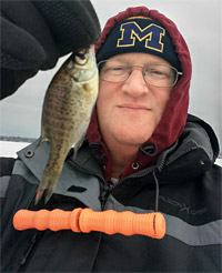 Tiny Lake Lansing bluegill caught on a Dot ice jig and spike combination