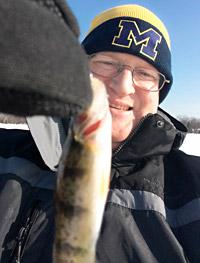 Tiny Lake Lansing Yellow Perch caught on a tiny Skandia Tungsten ice jig