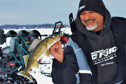 Mark Martin Pro-staff Mike Schneider shows a typical Houghton Lake walleye